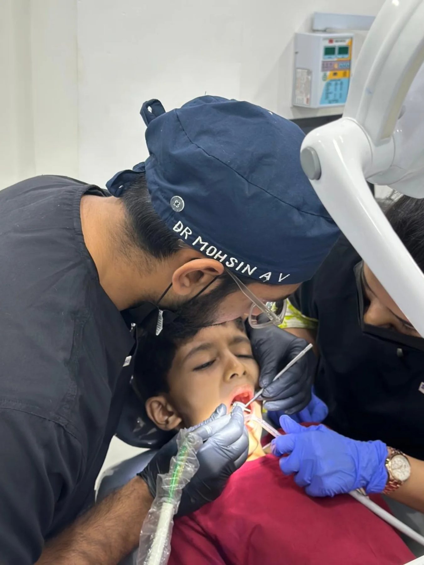 Dr. Mohsin providing real dental treatment for a child